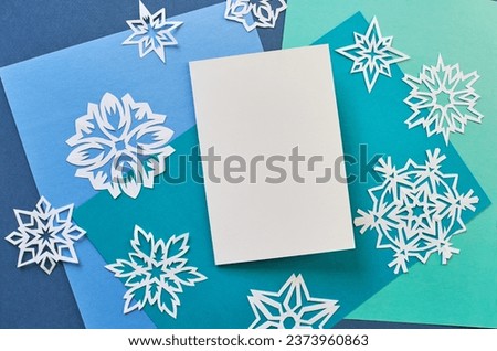  A stylish layout to showcase your winter holiday greetings. Cute vintage Christmas New Year gifts mockup on paper background. Flat lay top view.                              