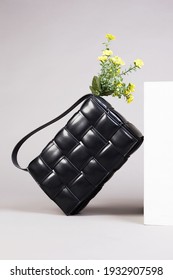 Stylish Leather Handbag With Yellow Flowers, Fashion Still Life. Female Black Bag