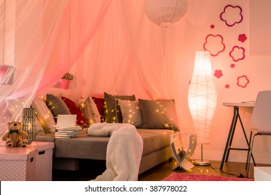 Stylish Lighted Teenage Girl's Bedroom With Comfortable Sofa