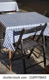 A Stylish Little Table For Two People In An Old Family Italian Restaurant In An Old Small European City Blue And White Checkered Pattern