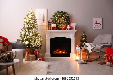 Stylish Living Room Interior With Beautiful Fireplace, Christmas Tree