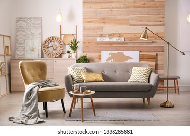 Stylish living room interior with comfortable sofa. Idea for home decor