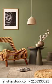 Stylish Living Room Interior Design With Rattan Chair, Mock Up Potser Frame, Side Table And Creative Accessories. Sage Green Wall. Template. Copy Space.
