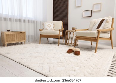 Stylish living room with soft white carpet and furniture. Interior design - Shutterstock ID 2366364909