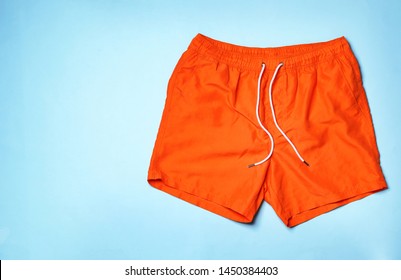 Stylish Male Swim Trunks On Color Background, Top View With Space For Text. Beach Object