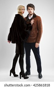 stylish man and glamour woman in fur coat posing - Shutterstock ID 425861818