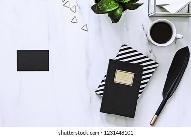 Stylish Marble Desk With Cup Of Coffee, Plant And Notes. Concept For Mock Up Bussines Card. Marble Background.