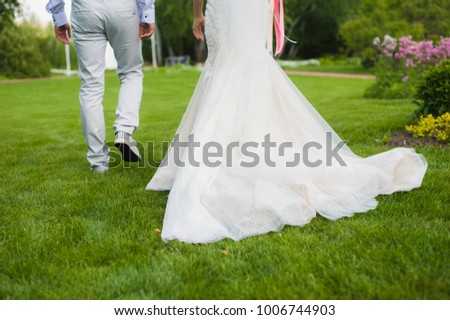 Stylish married couple walking away