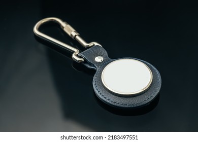 Stylish Masculine Metal Key Charm On Black Glass Background