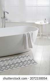 Stylish Mat On Floor Near Tub In Bathroom. Interior Design