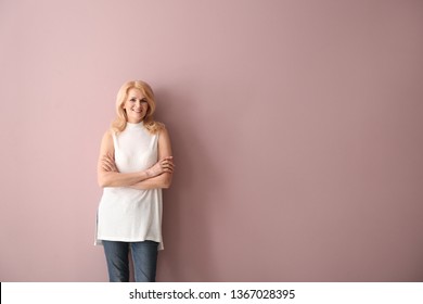 Stylish Mature Woman On Color Background