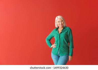 Stylish Mature Woman On Color Background