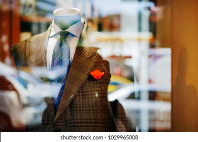 Stylish Men's Suit On A Wooden Mannequin In The Shop Window. Concept Fashion, Design, Style