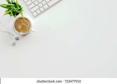 Stylish Minimalistic Workplace With Keyboard, Office Plant And Coffee In Flat Lay Style. White Background. Top View.