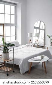 Stylish Mirror In Interior Of Bedroom