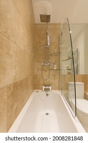 A Stylish Modern Bathroom With Built In Shower Cubicle Bath Tub And Toilet