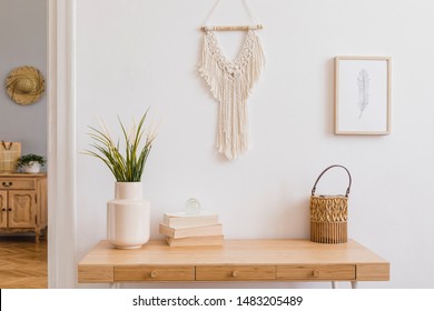 Stylish And Modern Boho Interior Of Living Room With Mock Up Photo Frames, Flowers In Vase, Wooden Desk, Beige Macrame And Elegant Accessories. Design Home Decor. Bohemian Concept. Mockup Ready To Use