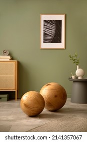 Stylish Modern Details Of Living Room Interior. Two Massive Wooden Balls. Sage Green Wall. Template. Copy Space. 
