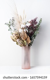 Stylish modern dried flower arrangement in a pink vase. Eucalyptus leaves, banksia, cotton flower ,gold palm, pampas grass and ruscus leaves. Art decoBoho gift for Anniversary, birthday, mothers day. - Shutterstock ID 1657594159