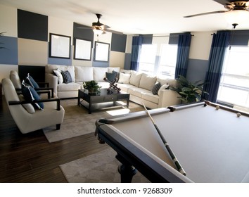 Stylish Modern Luxury Game Room Interior Design With Pool Table In Foreground.