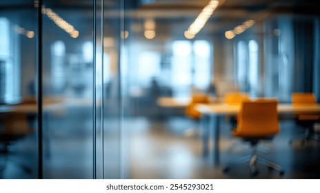 A stylish modern office interior featuring blurred glass partitions and vibrant orange chairs, creating a serene and inviting working atmosphere for creativity and collaboration. - Powered by Shutterstock