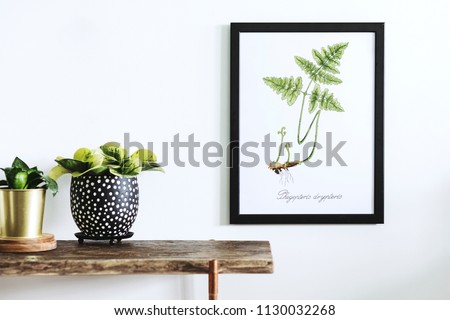 Stylish and modern scandinavian room with wooden console, mock up poster frame and beautiful plants. Design composition of home interior.