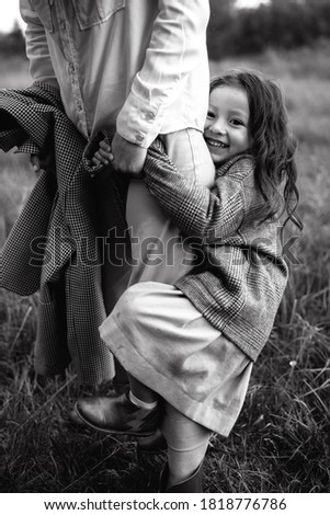 Similar – Mother with her seven year old daughter laughing in a cabin in the countryside.