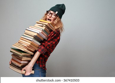 Stylish Nerd Girl With Many Books