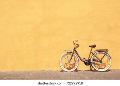 Stylish New Bicycle Near Color Wall Outdoors