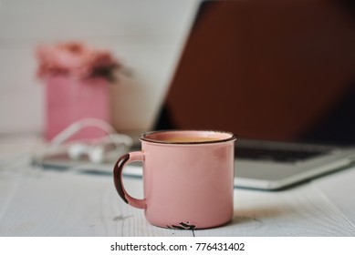 Stylish office desk workspace with laptop, notebook, pen, mug hot coffe with marshmallows and pink flowers on white vintage background. Lifestyle concept. Home office workspace. Women's desk. - Shutterstock ID 776431402