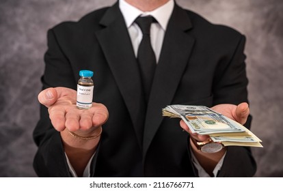 A Stylish Older Man In A Suit Carries The Vaccine In A Jar And Dollars For It. Vaccination Concept For Big Money