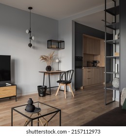 Stylish, Open Plan Studio Apartment With Home Office Area In Living Room And Modern, Small Kitchen