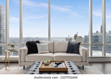 Stylish Penthouse Living Room with Skyline Views of City and Lakefront - Shutterstock ID 2107932644