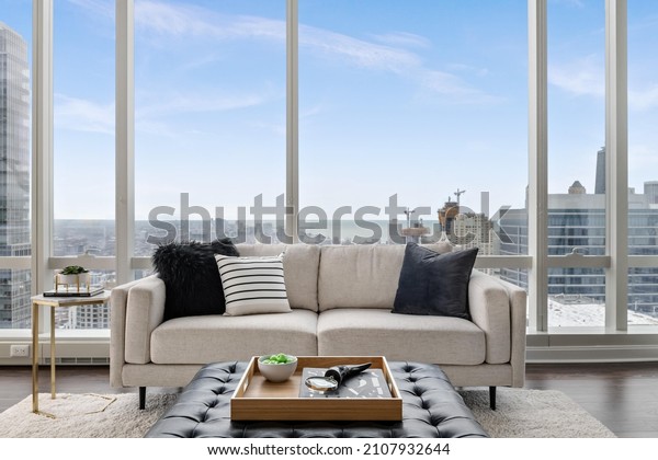 Stylish Penthouse Living Room with Skyline\
Views of City and\
Lakefront