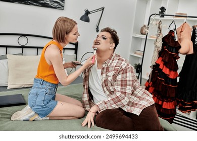 A stylish person enjoys a makeover session from their beautiful friend indoors. - Powered by Shutterstock