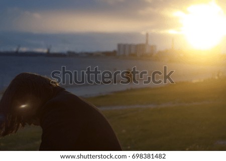 Similar – Image, Stock Photo Young woman with pipe backlit by the sea in the midnight sun