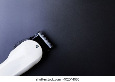 Stylish Professional Barber Clippers, Hair Clippers.Haircut accessories on dark background. - Powered by Shutterstock