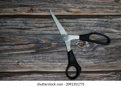 Stylish Professional Barber Scissors, Hair Cutting on wood background. Hairdresser salon concept, Hairdressing Set. Haircut accessories. Copy space image, flat lay