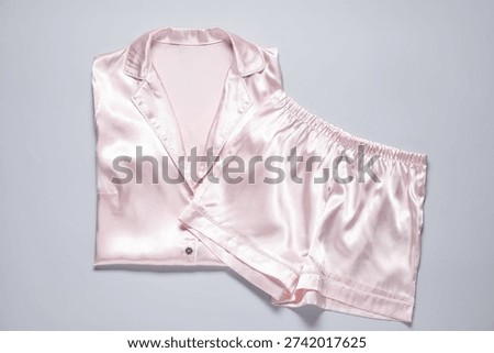 Stylish pyjamas on light grey background, top view