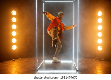 Stylish Rapper On The Stage With Illuminated Cube