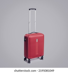 Stylish Red Rolling Suitcase With Four Wheels On Gray Background, Travel And Tourism Concept