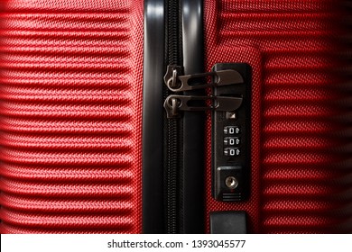 Stylish red suitcase with combination lock. - Powered by Shutterstock