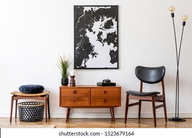 Stylish and retro living room with design vintage wooden commode, chair, footrest, black lamp and elegant personal accessories. Mock up poster map on the wall. Template. Vintage home decor.  - Shutterstock ID 1523679164