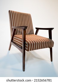 Stylish Retro Striped Armchair With Armrests On A White Cyclorama