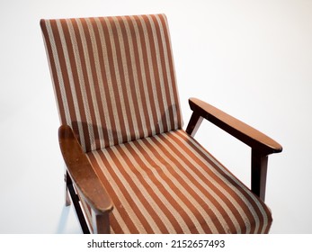 Stylish Retro Striped Armchair With Armrests On A White Cyclorama