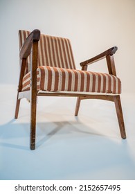 Stylish Retro Striped Armchair With Armrests On A White Cyclorama