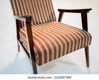 Stylish Retro Striped Armchair With Armrests On A White Cyclorama