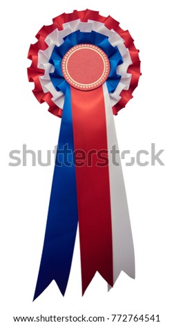 A stylish retro vintage Award rosette medal badge with ribbon in the USA united states and englands flag's colours. red and blue color. isolated and cutout on white.