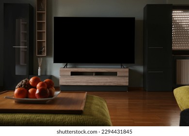 Stylish room with beautiful furniture and TV set on table. Interior design - Shutterstock ID 2294431845
