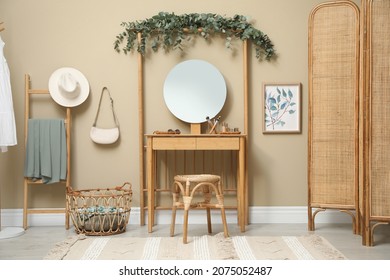 Stylish Room Decorated With Beautiful Eucalyptus Garland On Dressing Table